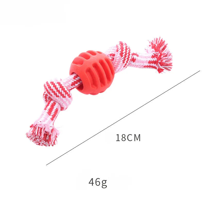 Blue silicone molar-ball dog chew toy with white rope ends on a wooden floor.