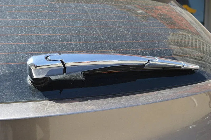 Set of four silvery ABS plastic rear window wiper cover trims for a 2010 Hyundai
