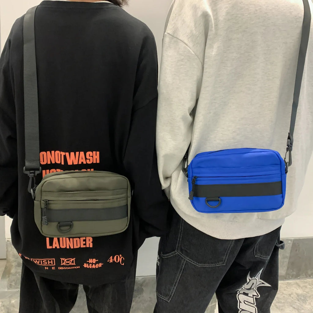 Men's street-style nylon messenger bag in a solid colour with adjustable crossbody strap.