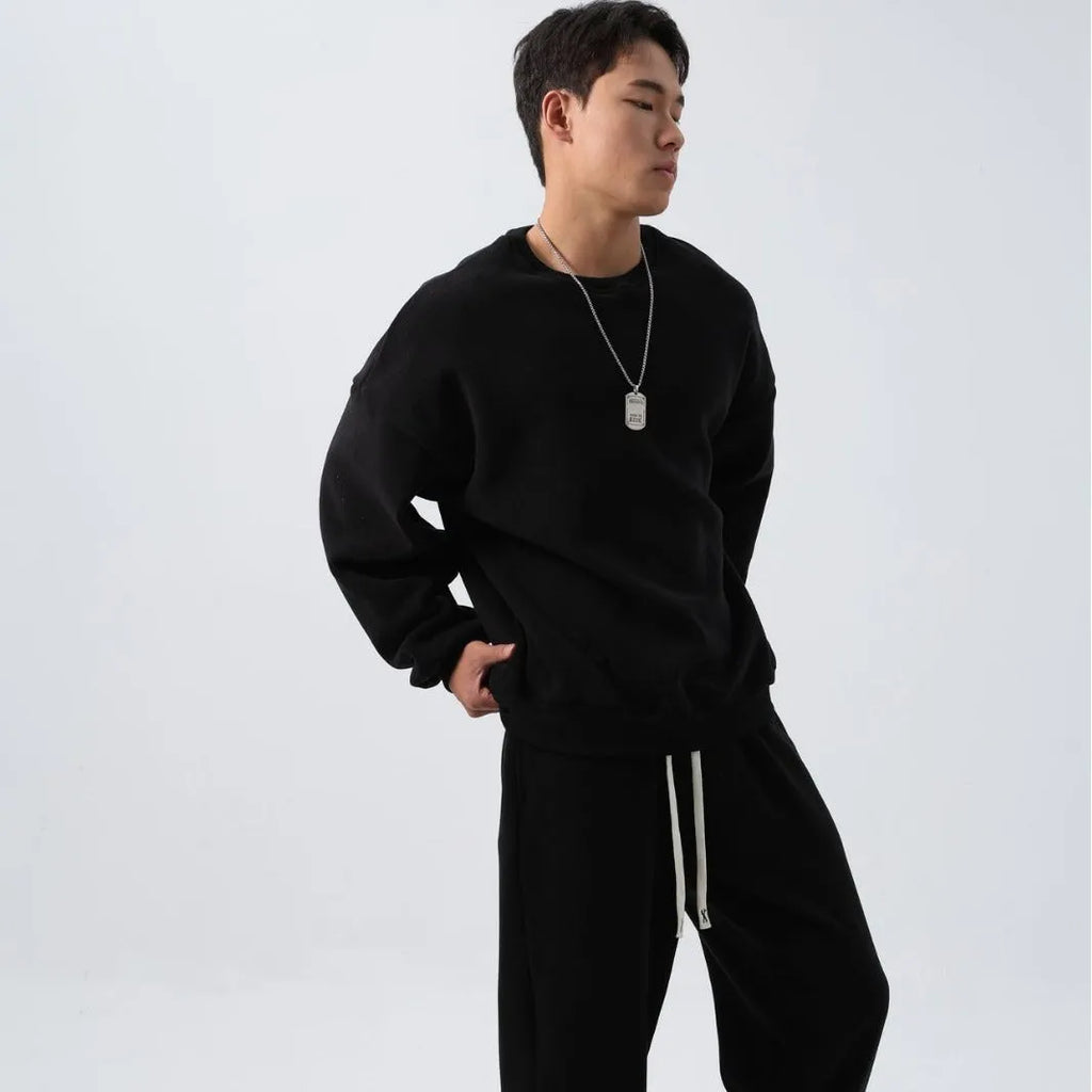 Men's polar fleece sports suit set showing crew neck top with long sleeves and matching padded trousers in winter colours