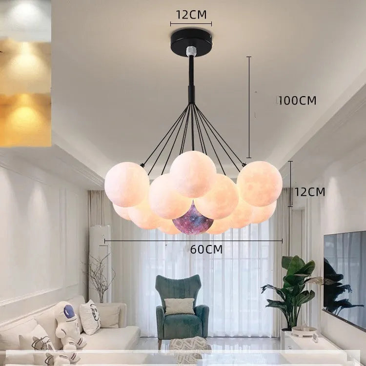 Nordic fish chandelier with moon bubble design in gold or black colours, showing iron body and PMMA lampshades
