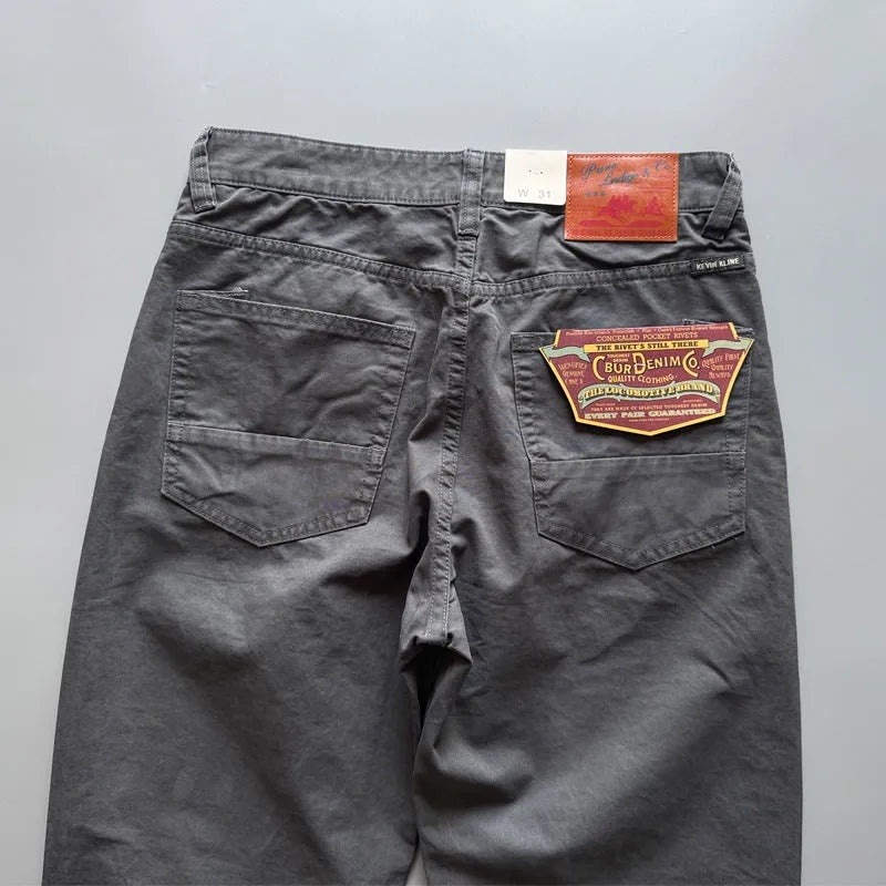 Men's straight-leg casual cotton trousers in grey, shown flat.