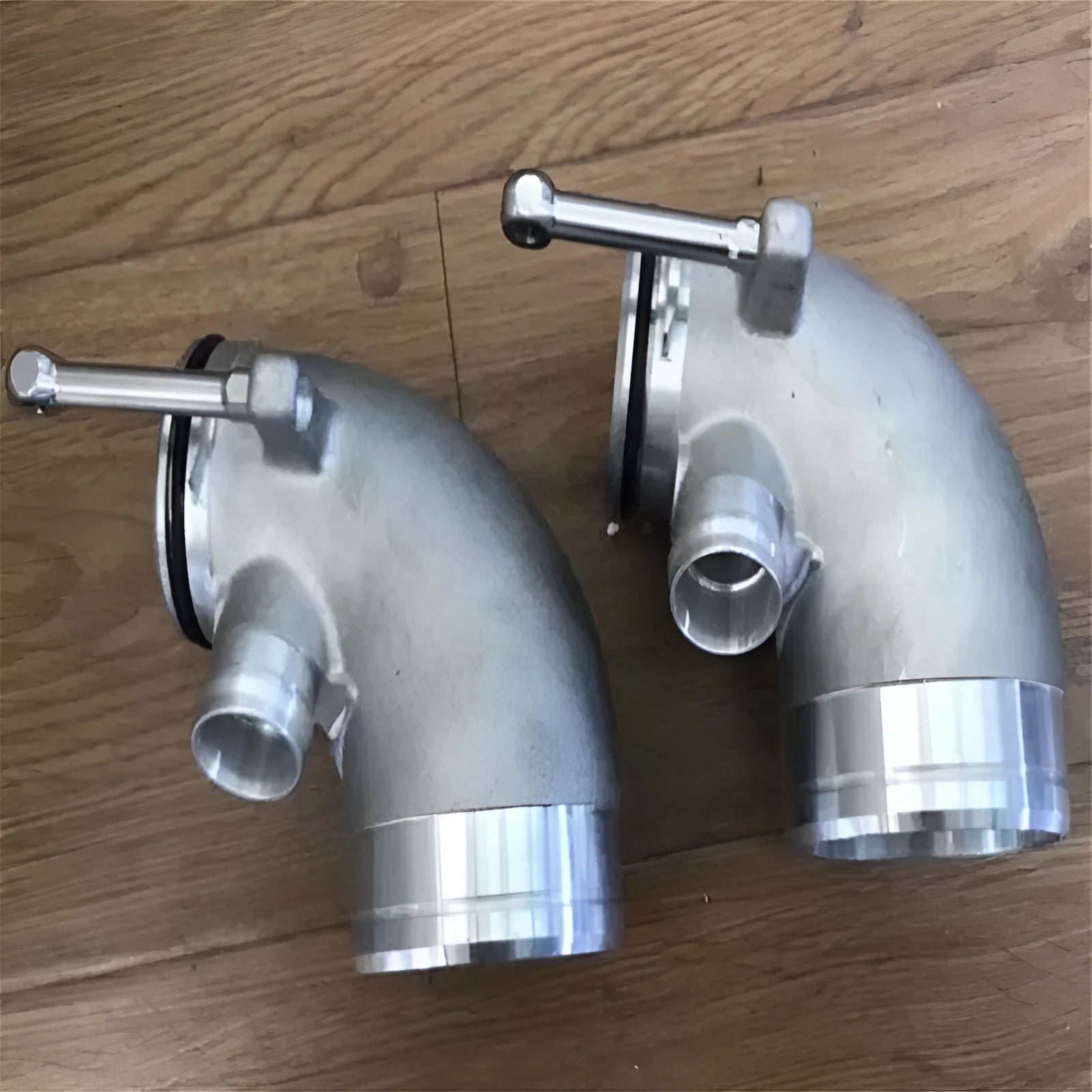 Aluminium alloy 90-degree turbine elbow pipe for lateral engine automotive applications