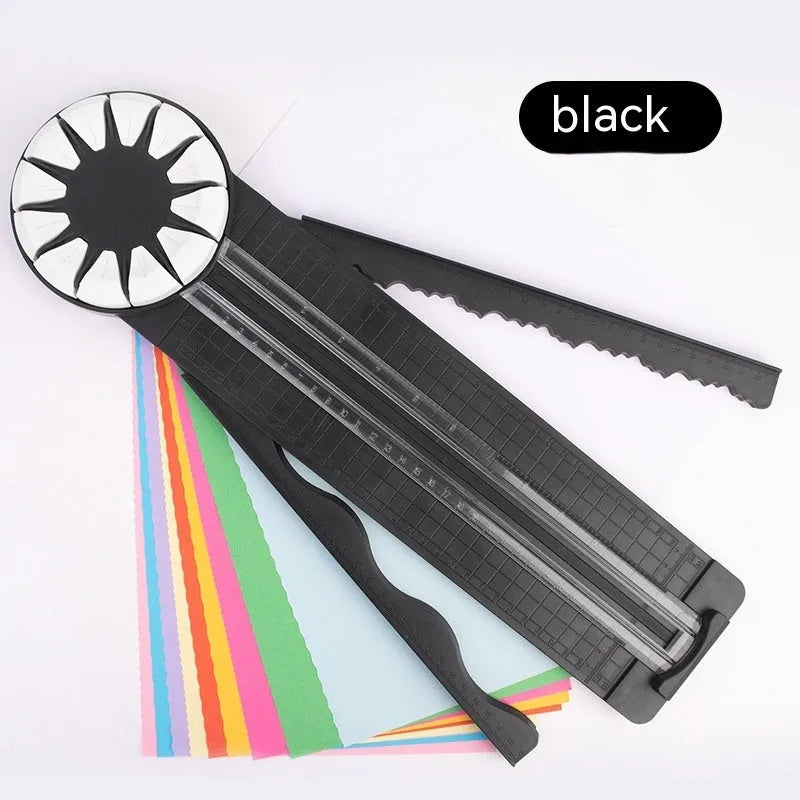 Pink plastic paper cutting machine with dotted pattern design and 12 interchangeable blades