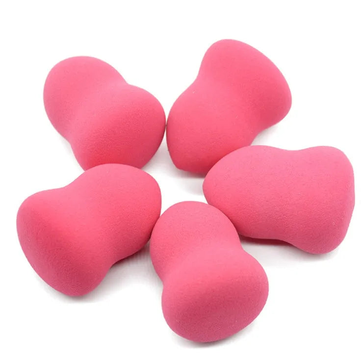 Pink non-latex makeup foundation sponge on a white background showing its 4x4x5.6cm size.