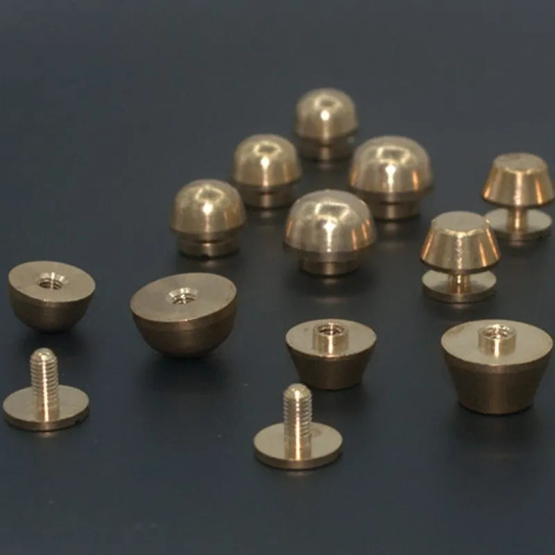 Brass decorative buckle foot nails in round and bucket head shapes, sizes 10x6mm and 12x7mm.