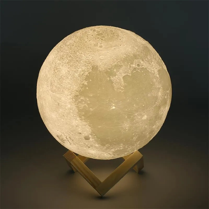 3D printed white moon lamp on wooden stand showing detailed lunar surface texture.