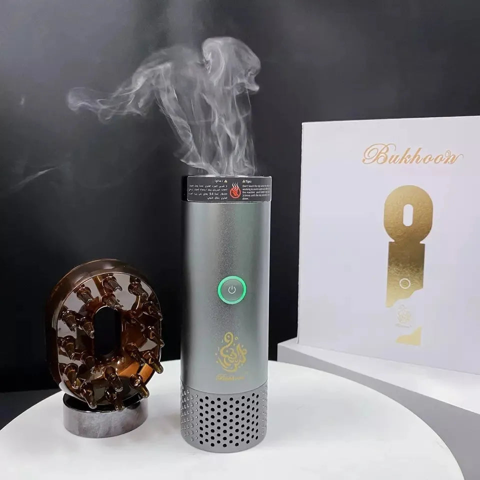 USB rechargeable Middle Eastern comb aromatherapy stove in silver, 14x5x4cm, on a car dashboard