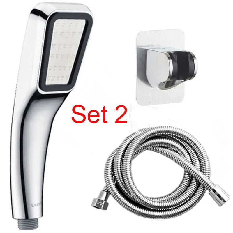 Hand-held pressurised rain shower head in orange and seven set configurations