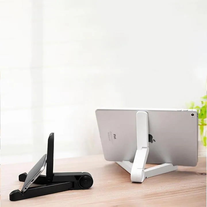 Black foldable tablet holder standing upright with a tablet in landscape mode on a wooden desk