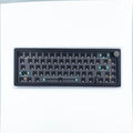 DIY mechanical keyboard kit components with RGB keys and knob on a black ABS case.