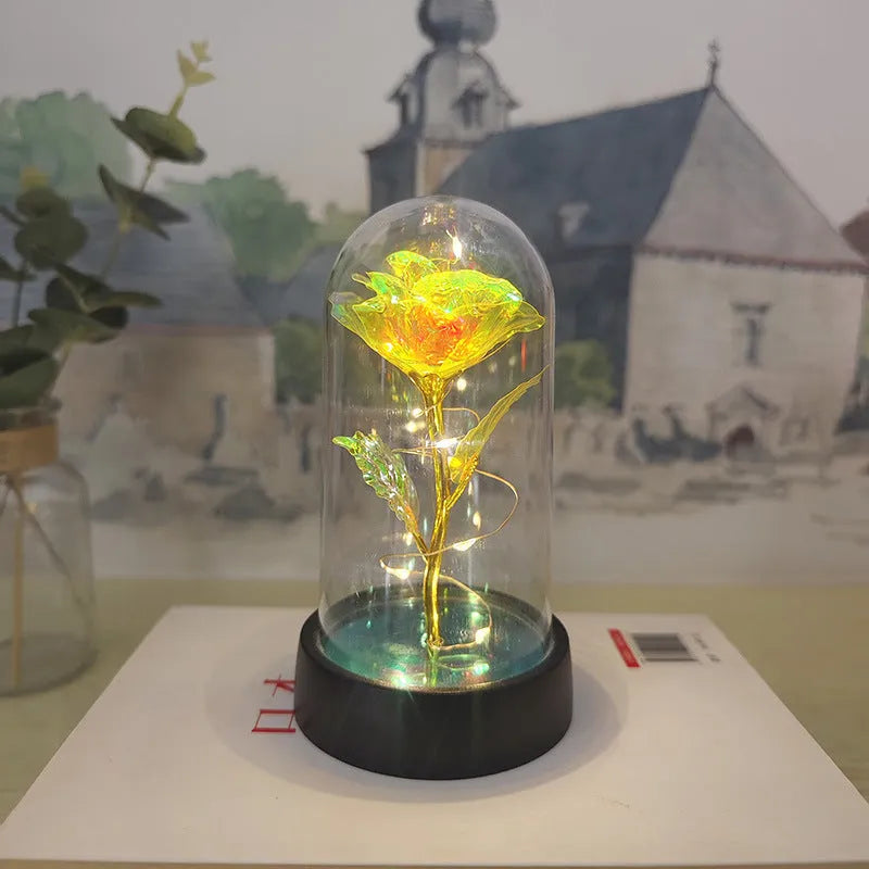 Glass cover small night lamp with plastic flowers in 15cm tall design with black base