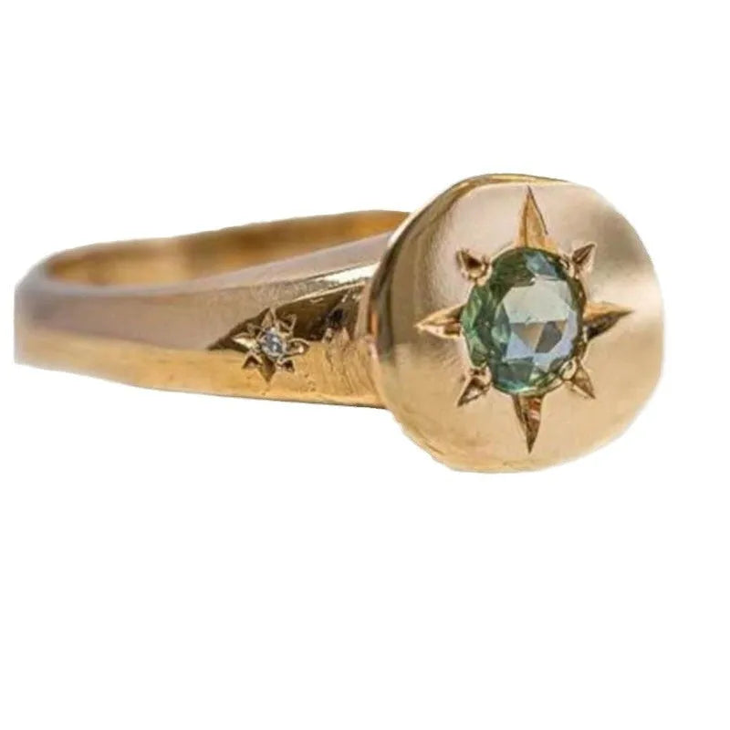 Gold-coloured adjustable ring with a detailed star and oval asterism zircon design.