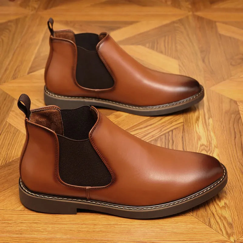 Formal black pointed-toe leather boots with a square heel and rubber sole on a plain background.
