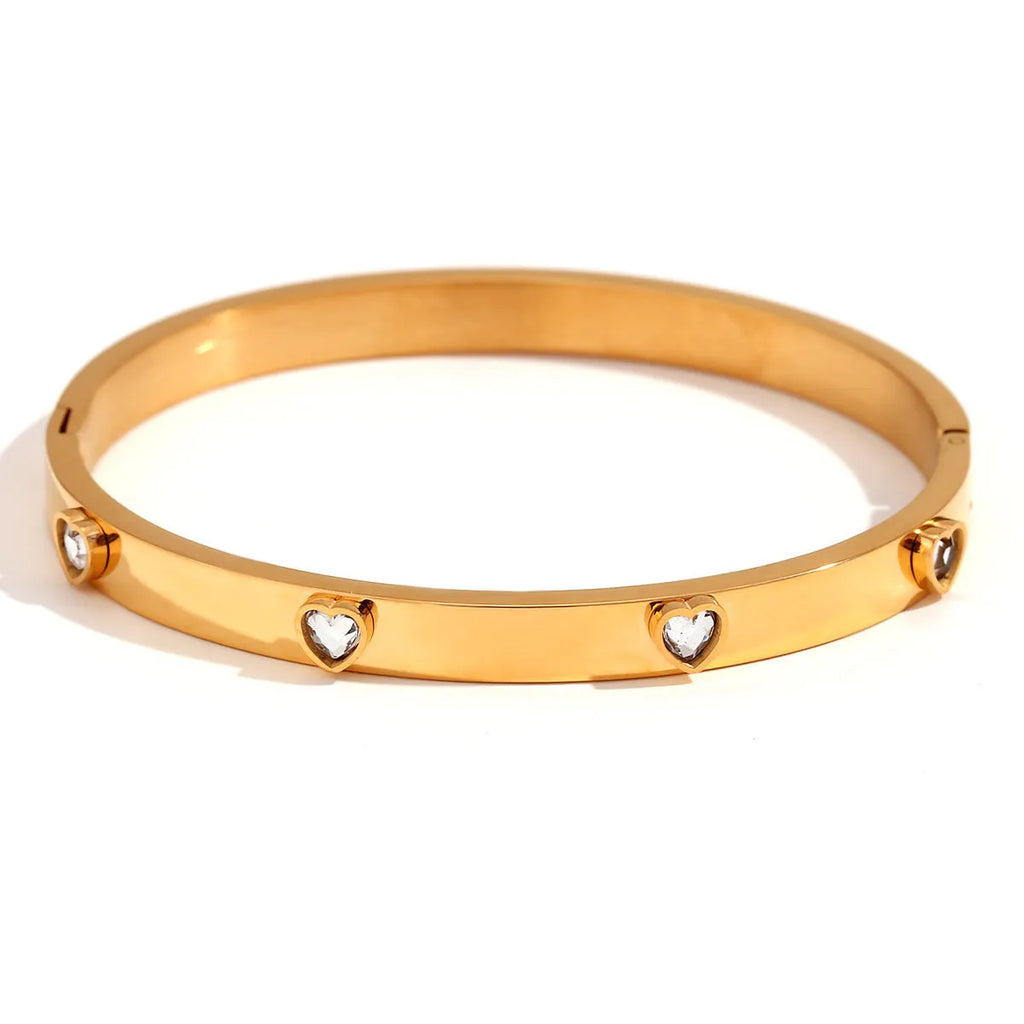 Golden stainless steel bracelet with micro-inlaid peach heart pendant and zircon or diamond accents