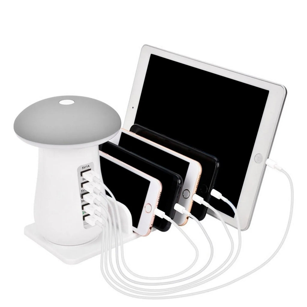 White USB charging dock station with 5 ports and a mushroom-shaped LED night lamp on a desk