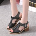 Women's retro sandals in creamy white with a side zipper and mid heel.