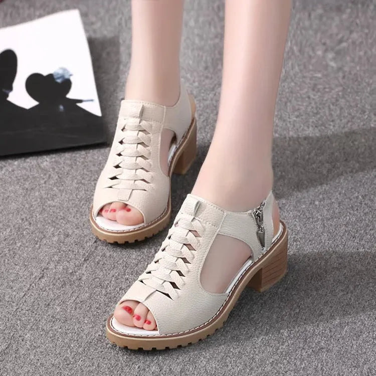 Women's retro sandals in creamy white with a side zipper and mid heel.