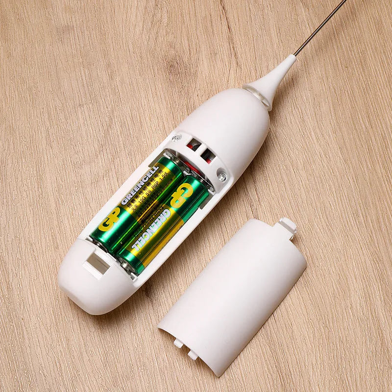 Black and white hand-held electric milk frother blender for coffee