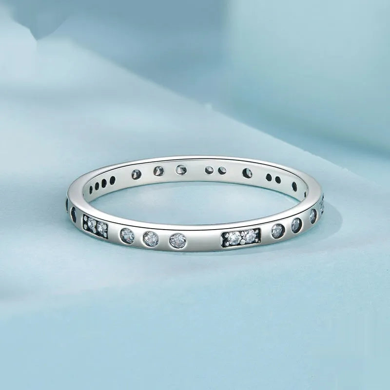 Sterling silver 'I Love You' Morse code ring with black oxidised finish on a plain background.