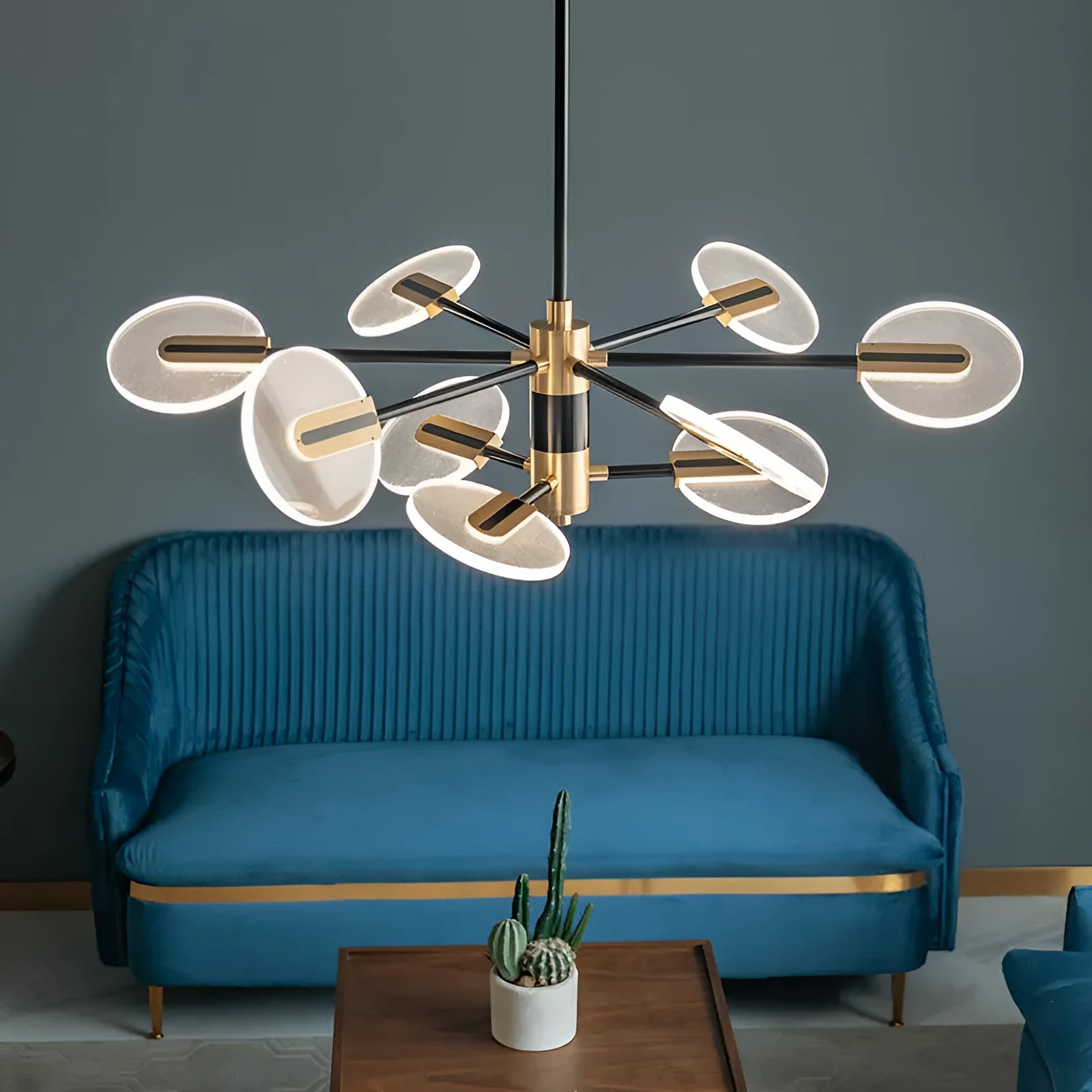 Nordic style black iron chandelier with multiple acrylic lamp shades hanging from ceiling