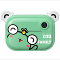 Blue digital printing camera with 2.4-inch screen showing image preview, alongside printed photo and accessories