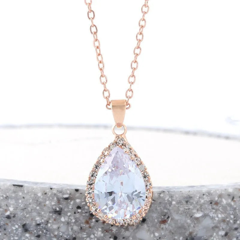 Pink rose gold drop shape rhinestone necklace with geometric design on alloy chain