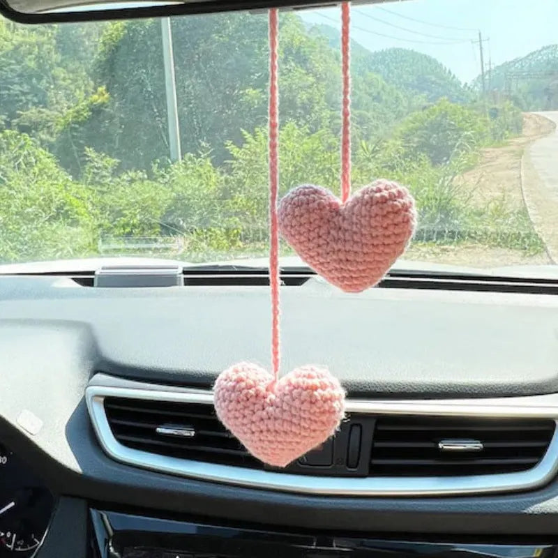 Green and white fish-scale style knitted wool car hanging planter with 8cm base and long white cord.