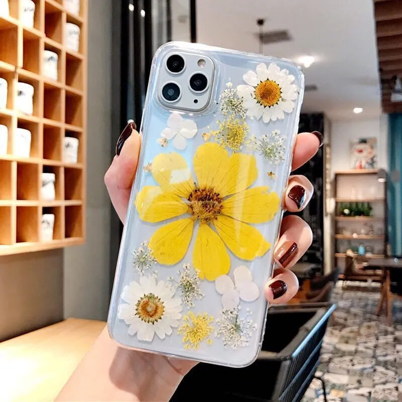 Floral TPU phone case with large pink flower design on back, shown fitted on an iPhone.