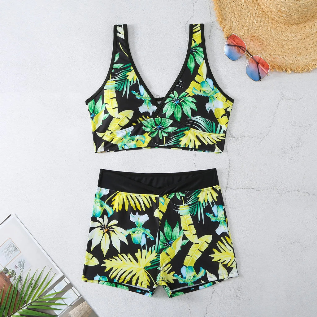 Women's two-piece swimsuit with sleeveless top and printed boxer brief bottoms in a multi-colour pattern.