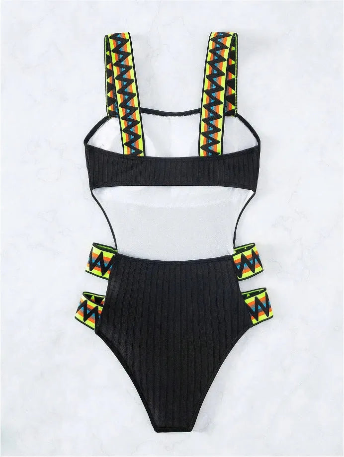 Women's solid colour one-piece swimsuit in black or orange, made from polyester fabric.