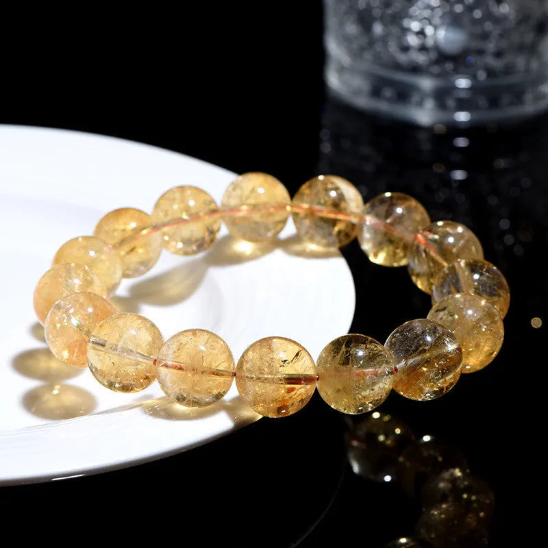 Natural yellow citrine bead bracelet showing geometric stone shapes in single circle and three circle configurations