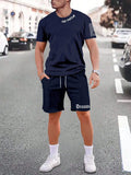 Sports-style short sleeve shirt and matching shorts set in a printed pattern, shown in colour G23P1573.