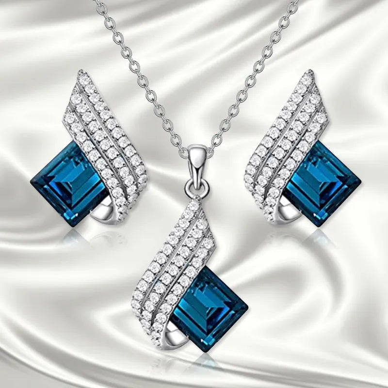 Women's necklace and ear stud set with alloy pendant, cross chain, and glass detailing in electroplated finish