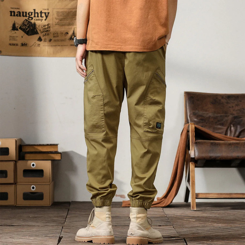 Men's khaki peacock green harem pants with tapered ankle bands and mid-waist design
