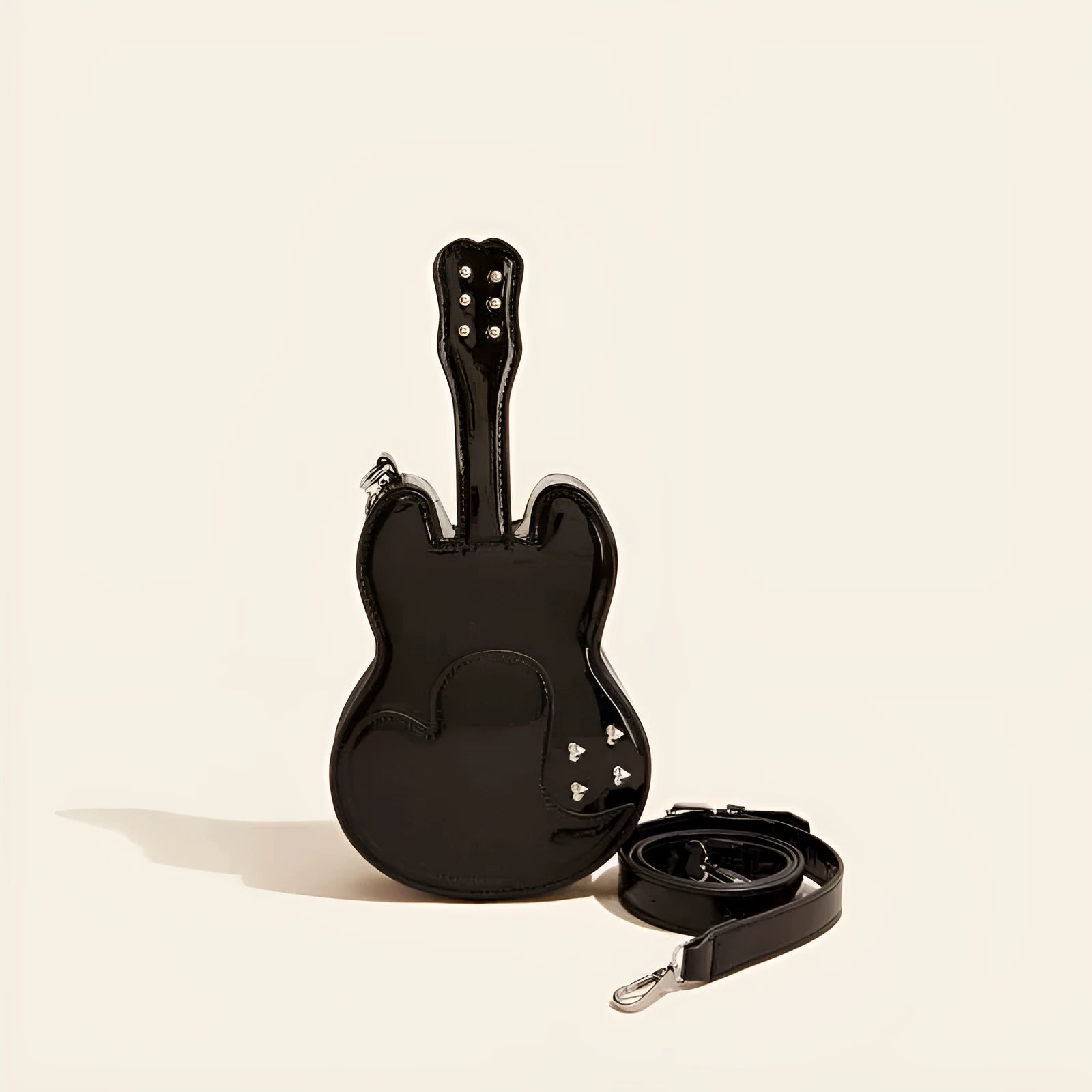 Guitar-shaped black PU leather crossbody shoulder bag showing front design