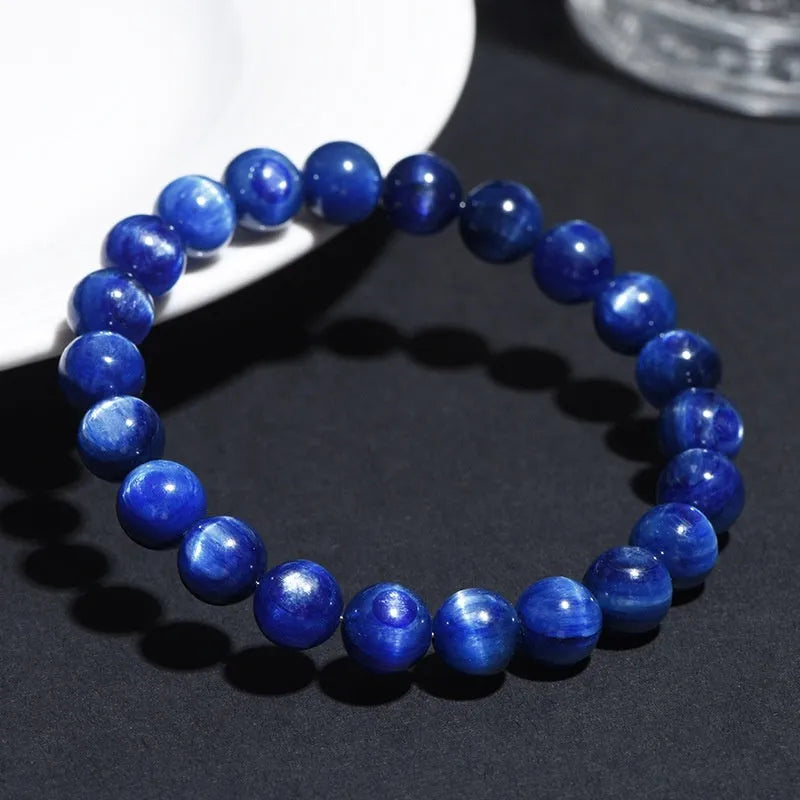 Polished grade 7A blue crystal bracelet with geometric ruyi design, shown in single circle and piece sizes.