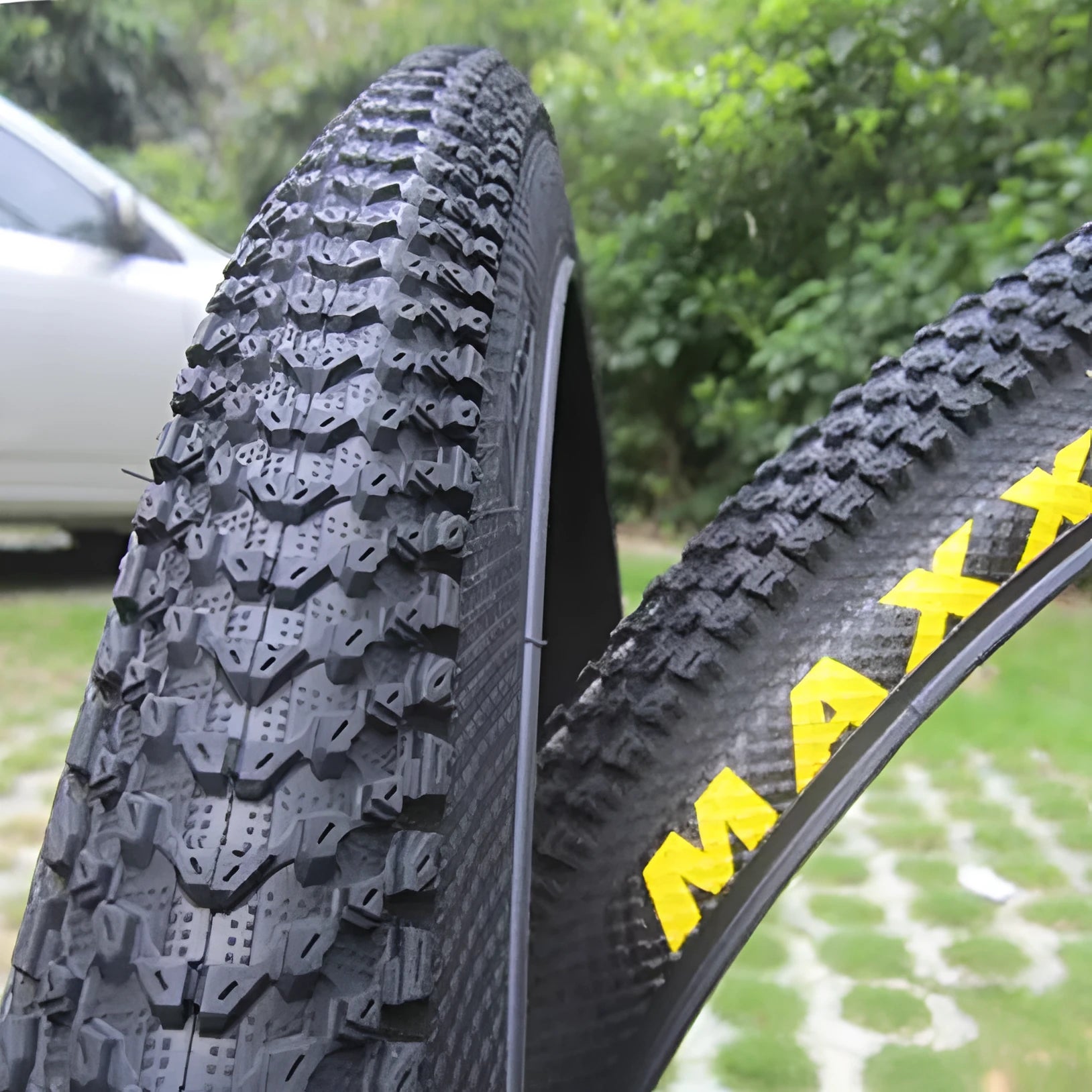 Ultralight puncture-resistant mountain bike tyre shown in black with white label option, for 26, 27.5 and 29-inch wheels.