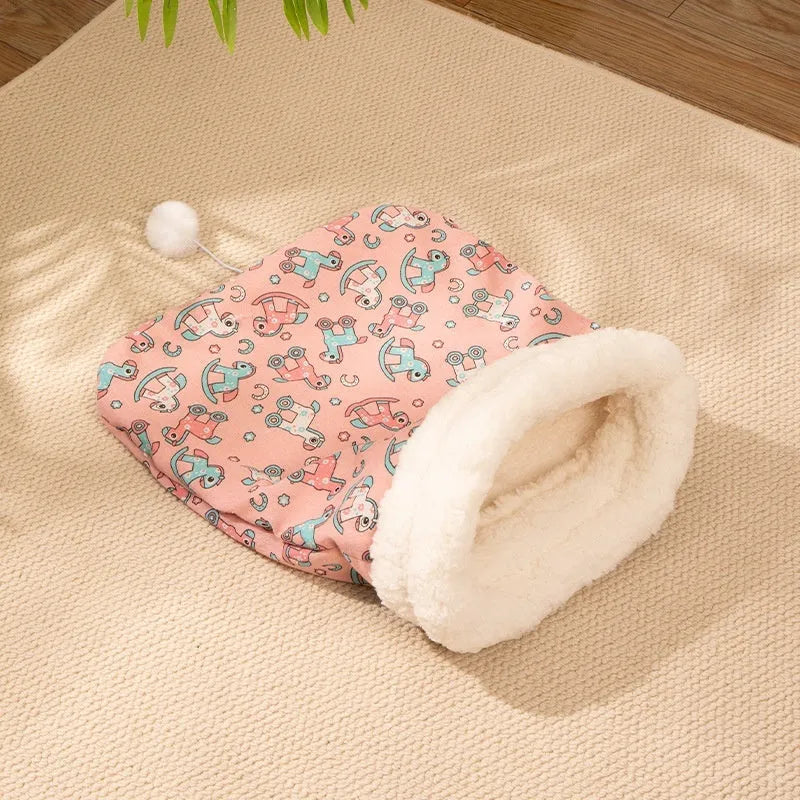 Flannel cat sleeping bag pet bed in pink Trojan pattern, 50cm by 40cm.
