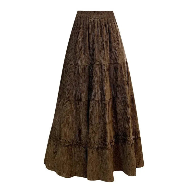 Women's beige corduroy A-line midi skirt with elastic waistband, shown on a hanger.
