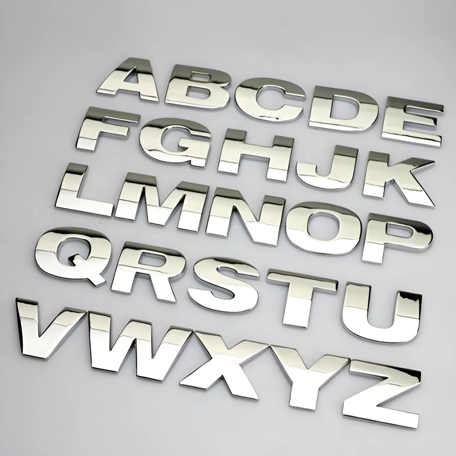 Metal zinc alloy car letter stickers showing dimensional 3D construction in black and silver finishes