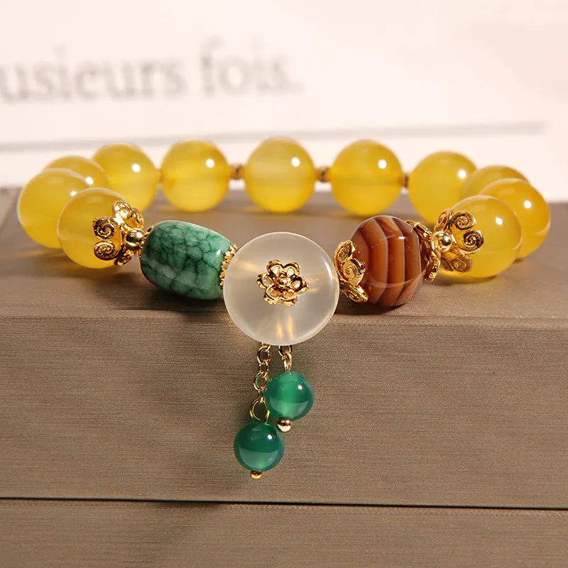 Khaki yellow agate crystal bracelet for women with gold silk threading.