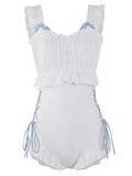 Milky white women's backless one-piece nylon swimsuit laid flat, showing sleeveless design.