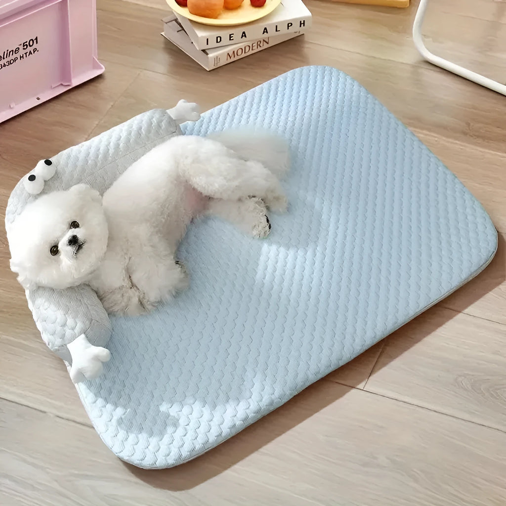 Blue pet bed with big-eyed monster design for dogs and cats, showing non-slip base and breathable fabric.