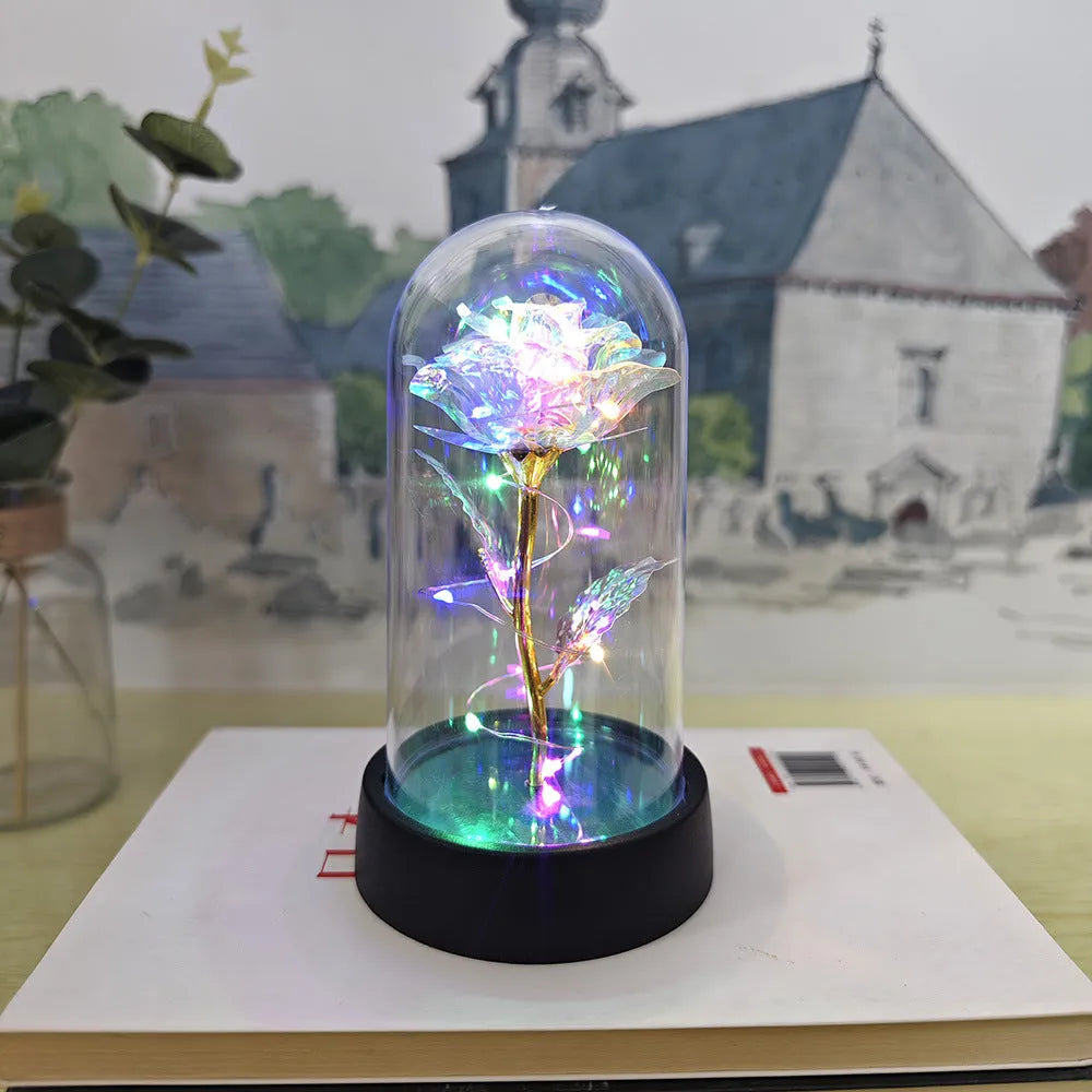 Glass cover small night lamp with plastic flowers in 15cm tall design with black base