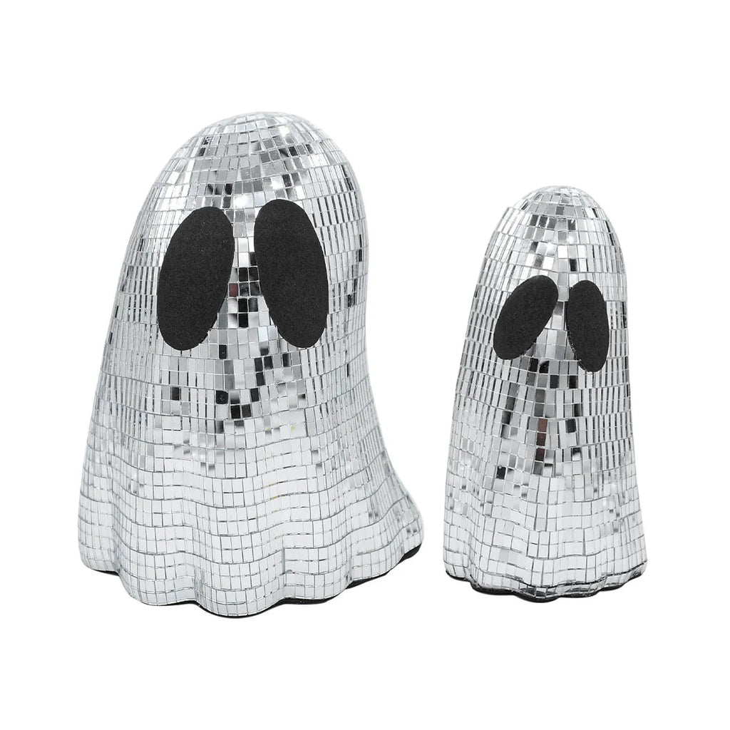 Silver glass Halloween ghost ornament with mosaic inlaid surface on a desktop.