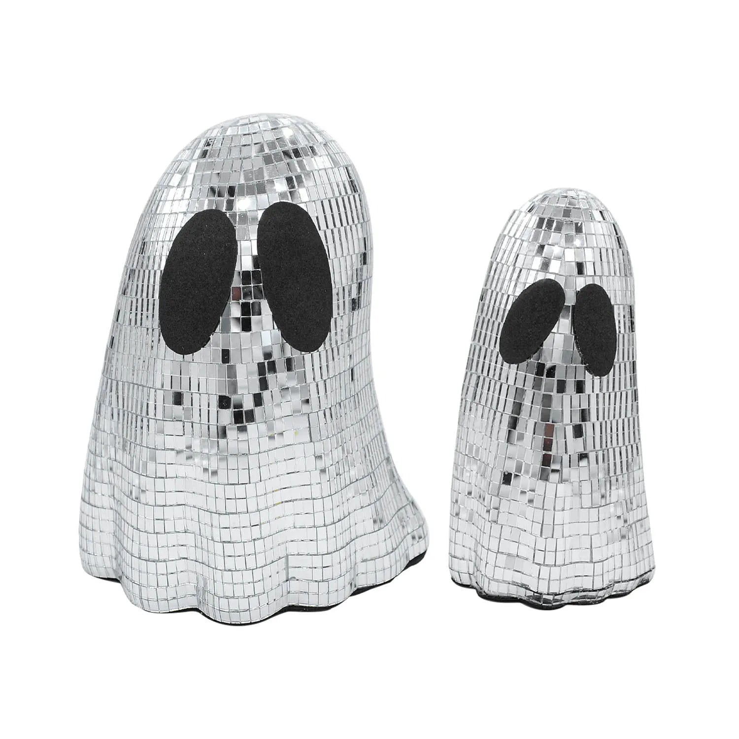 Silver glass Halloween ghost ornament with mosaic inlaid surface on a desktop.