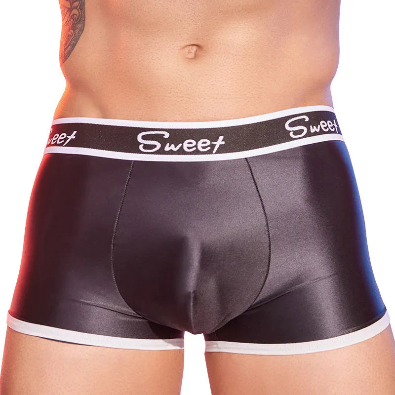 Men's nylon boxers in black, sapphire blue, and white colours, showing silky fabric texture.