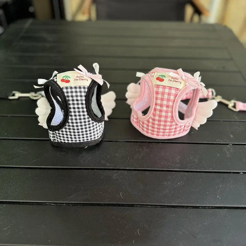Small dog wearing pink cotton chest and back harness with adjustable straps