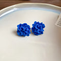 Women's geometric cloth earrings with silver needle colour and blue resin flower accents